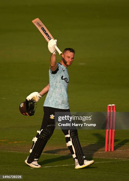 Laurie Evans of Surrey celebrates their century during the Vitality T20 Blast match between Glamorgan and Surrey at Sophia Gardens on June 07, 2023...