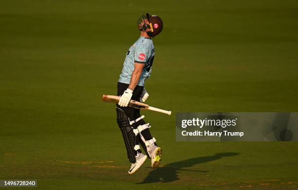 Laurie Evans of Surrey celebrates their century during the Vitality T20 Blast match between Glamorgan and Surrey at Sophia Gardens on June 07, 2023...