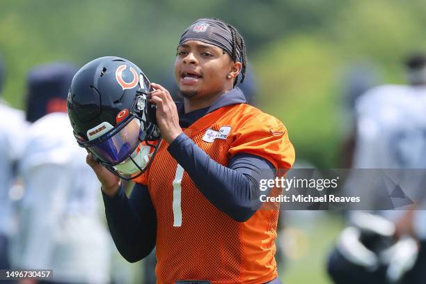 Justin Fields of the Chicago Bears looks on during OTA's at Halas Hall on June 07, 2023 in Lake Forest, Illinois.