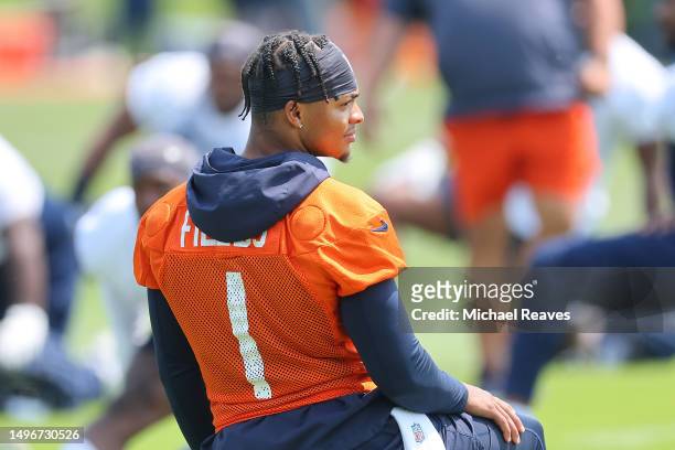 Justin Fields of the Chicago Bears looks on during OTA's at Halas Hall on June 07, 2023 in Lake Forest, Illinois.