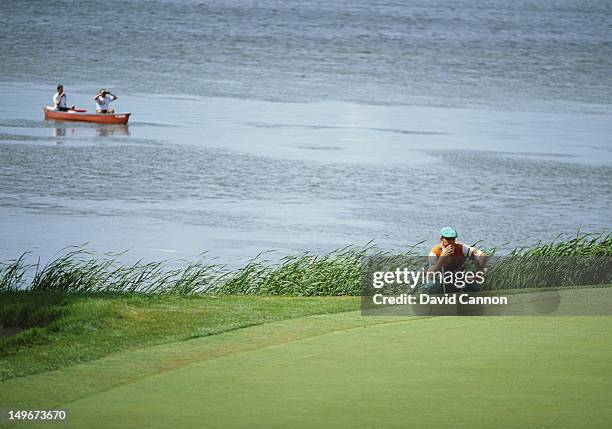 Payne Stewart of the United States considers his next shot beside the lake during the US Open Golf Tournament on 14th June 1991 at the Hazeltine...