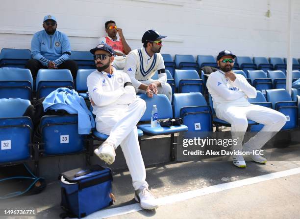 Virat Kohli, Ajinkya Rahane and Rohit Sharma of India wait after tea during day one of the ICC World Test Championship Final between Australia and...