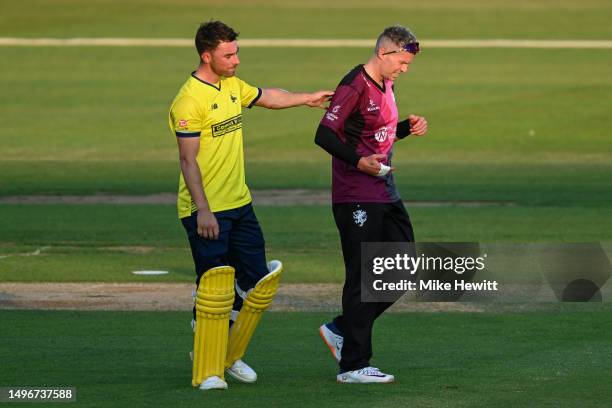 Joe Weatherley of Hampshire apologises to Peter Siddle of Somerset after damaging his hand with a powerful shot during the Vitality Blast T20 match...