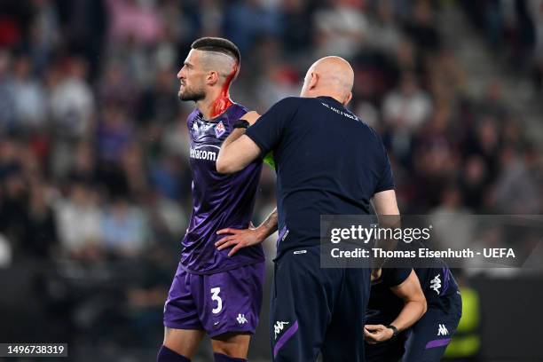 Cristiano Biraghi of ACF Fiorentina receives medical treatment during the UEFA Europa Conference League 2022/23 final match between ACF Fiorentina...