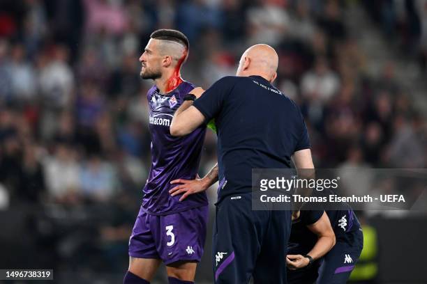 Cristiano Biraghi of ACF Fiorentina receives medical treatment during the UEFA Europa Conference League 2022/23 final match between ACF Fiorentina...