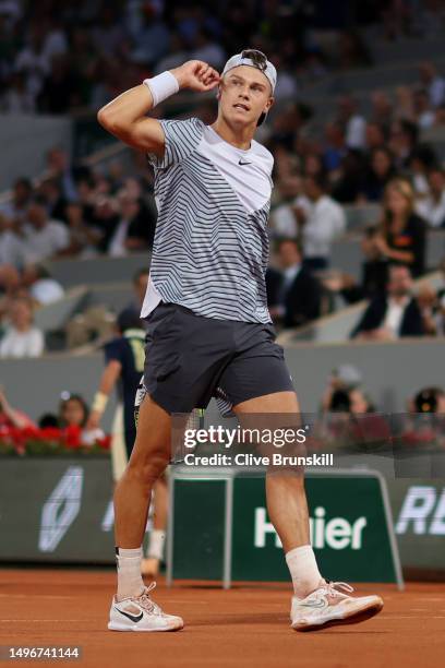Holger Rune of Denmark celebrates a point against Casper Ruud of Norway during the Men's Singles Quarter Final match on Day Eleven of the 2023 French...