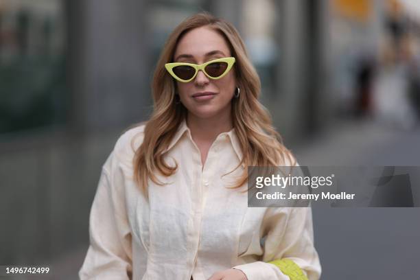 Sonia Lyson wearing Bottega Veneta lime yellow Jodie leather bag, Tods beige ballerinas, H&M grey joggingpants, Miu Miu beige logo underwear, & other...