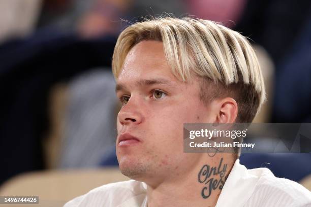 Chelsea Footballer, Mykhailo Mudryk, watches on from the crowd during the Men's Singles Quarter Final match between Holger Rune of Denmark and Casper...