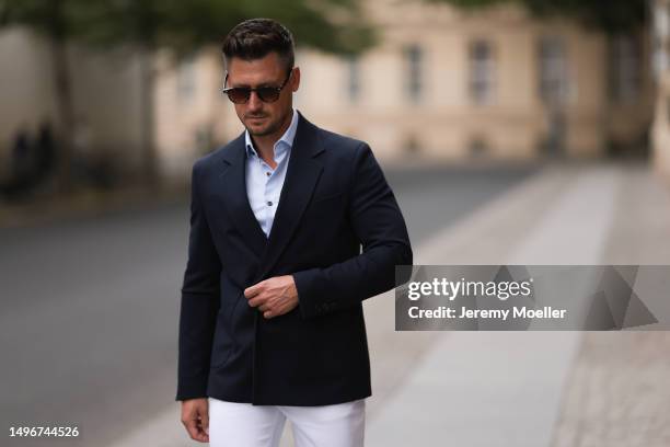 Andre Hellmundt wearing Massimo Dutti brown leather velvet loafer, Massimo Dutti black leather belt, white denim pants, Olymp light blue flanell and...