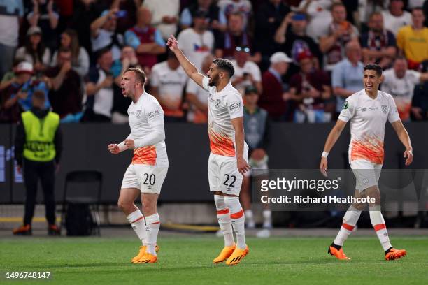 Said Benrahma of West Ham United celebrates with teammates Jarrod Bowen and Nayef Aguerd after scoring the team's first goal from the penalty spot...