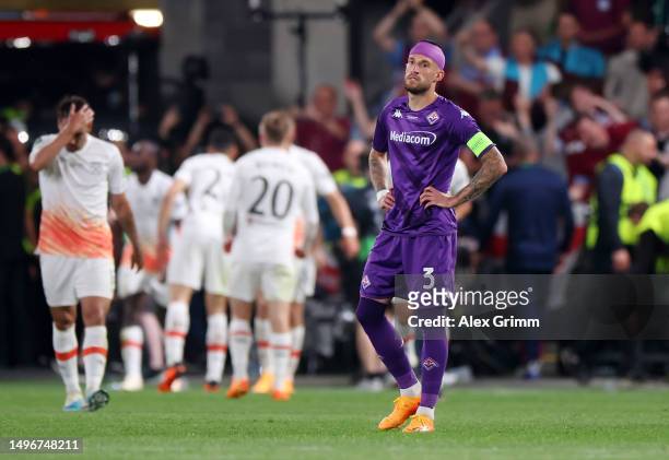 Cristiano Biraghi of ACF Fiorentina looks dejected after Said Benrahma of West Ham United scores the team's first goal from the penalty spot during...