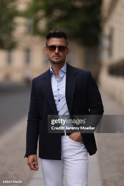 Andre Hellmundt wearing Massimo Dutti brown leather velvet loafer, Massimo Dutti black leather belt, white denim pants, Olymp light blue flanell and...