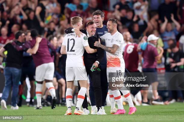 Flynn Downes, Mark Noble, and Danny Ings of West Ham United celebrate after the team's victory during the UEFA Europa Conference League 2022/23 final...