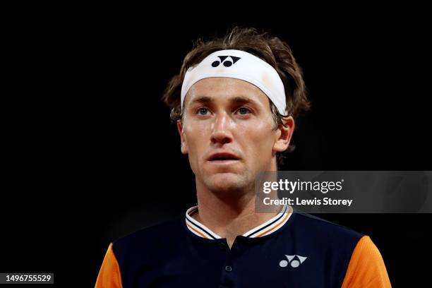 Casper Ruud of Norway looks on against Holger Rune of Denmark during the Men's Singles Quarter Final match on Day Eleven of the 2023 French Open at...