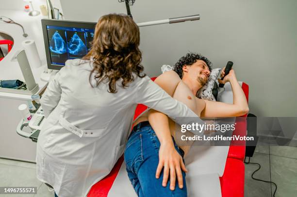 man having an ultrasound examination - ultrasound chest stock pictures, royalty-free photos & images