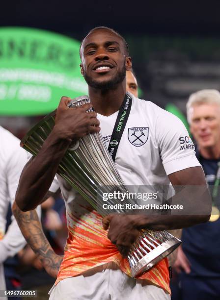 Michail Antonio of West Ham United celebrates with the UEFA Europa Conference League trophy after the team's victory during the UEFA Europa...