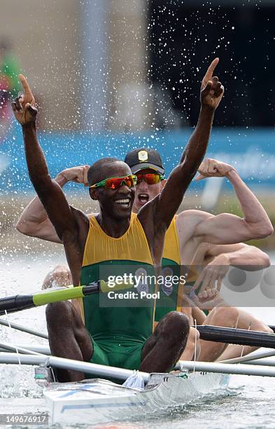 Sizwe Ndlovu, John Smith, Matthew Brittain and James Thompson of South Africa celebrate after winning gold in the Lightweight Men's Four final on Day...