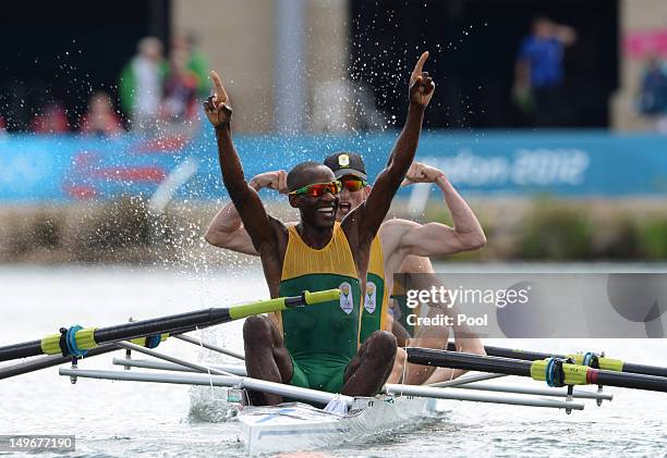 Sizwe Ndlovu, John Smith, Matthew Brittain and James Thompson of South Africa celebrate after winning gold in the Lightweight Men's Four final on Day...