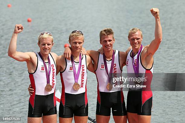Eskild Ebbesen, Jacob Barsoe, Morten Jorgensen and Kasper Winther of Denmark celebrate with their bronze medals during the medal ceremony for the...