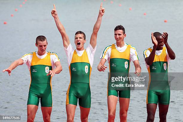 Sizwe Ndlovu, John Smith, Matthew Brittain and James Thompson of South Africa celebrate before receiving their gold medals during the medal ceremony...