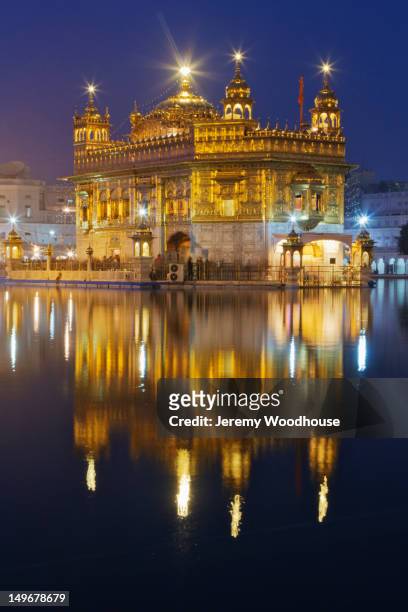 glowing, ornate indian building - golden temple india stock pictures, royalty-free photos & images