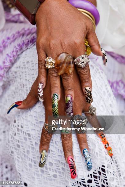 close up of decorated long fingernails - nagelkunst stockfoto's en -beelden