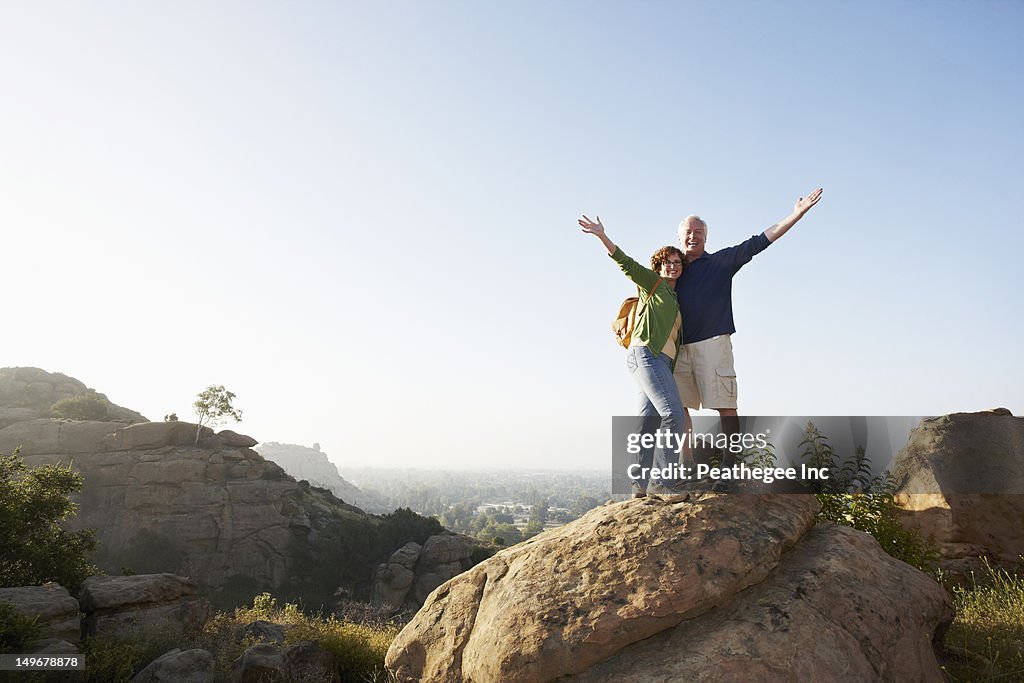 Caucasian couple hiking in remote area