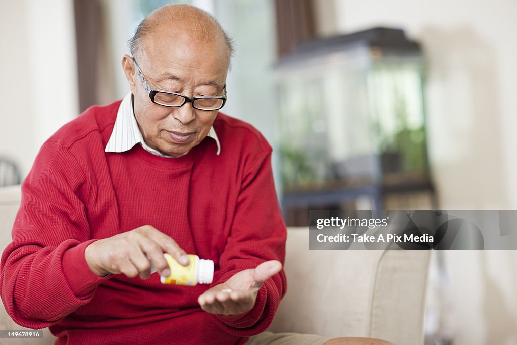Chinese man taking medication