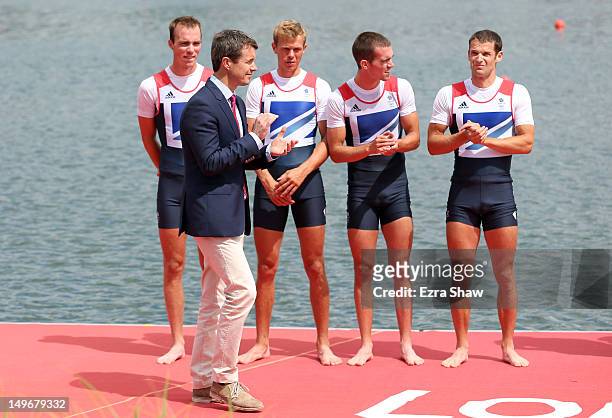 Chris Bartley, Richard Chambers, Rob Williams and Peter Chambers of Great Britain wait to receive their silver medals from Prince Frederik of Denmark...