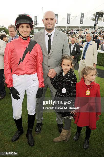 Rosemary Ferguson and Jake Chapman pose with their children during Ladies Day at Glorious Goodwood held at Goodwood Racecourse on August 2, 2012 in...