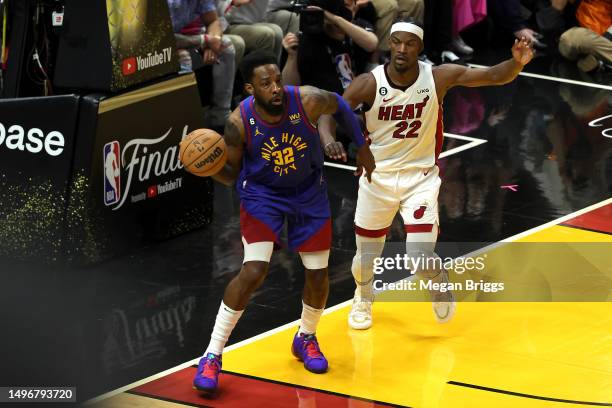 Jeff Green of the Denver Nuggets looks to pass defended by Jimmy Butler of the Miami Heat during the second quarter in Game Three of the 2023 NBA...