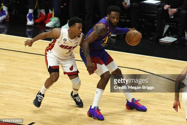 Jeff Green of the Denver Nuggets dribbles against Kyle Lowry of the Miami Heat during the first half in Game Three of the 2023 NBA Finals at Kaseya...