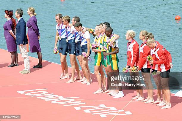 Prince Frederik of Denmark stand s next to Silver medalists great Britain, gold medalists South Africa, and bronze medalists Denmark as they pose...
