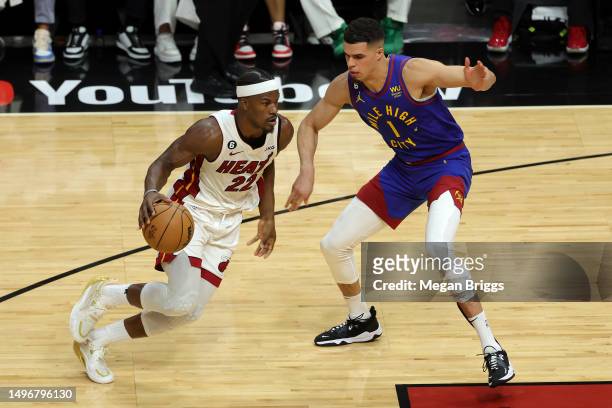 Jimmy Butler of the Miami Heat drives against Michael Porter Jr. #1 of the Denver Nuggets during the second quarter in Game Three of the 2023 NBA...