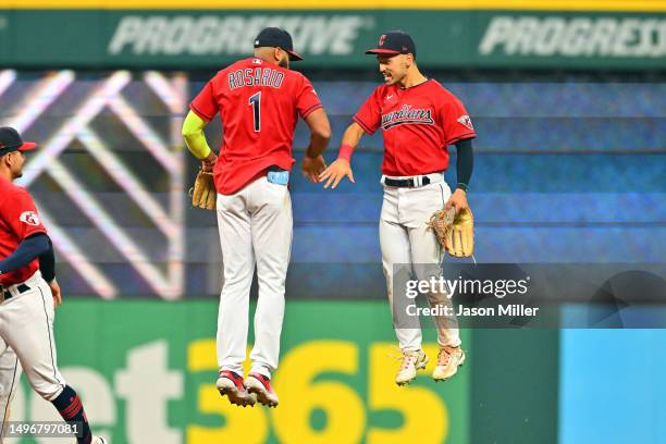 Amed Rosario celebrates with Steven Kwan of the Cleveland Guardians after the Guardians defeated the Boston Red Sox at Progressive Field on June 07,...