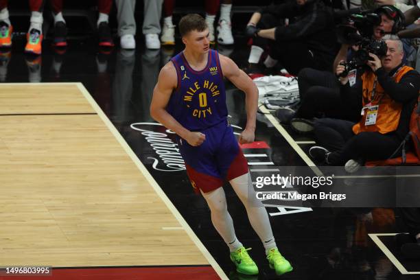 Christian Braun of the Denver Nuggets reacts after a dunk during the third quarter against the Miami Heat in Game Three of the 2023 NBA Finals at...