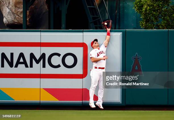Mike Trout of the Los Angeles Angels makes the fly out against Ian Happ of the Chicago Cubs in the fourth inning at Angel Stadium of Anaheim on June...