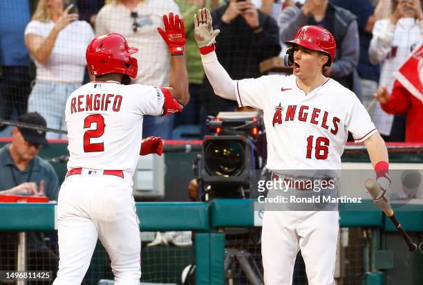 Luis Rengifo of the Los Angeles Angels celebrates a home run with Mickey Moniak against the Chicago Cubs in the fifth inning at Angel Stadium of...