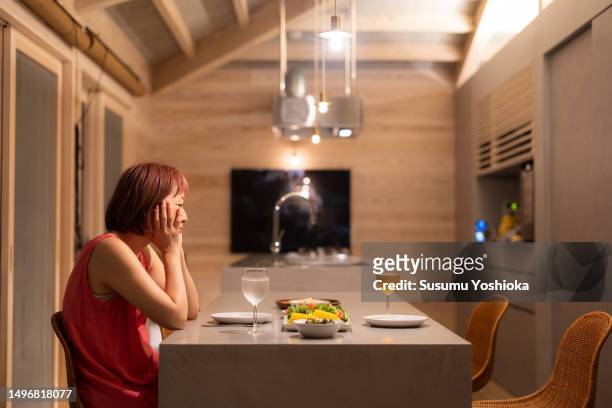 a couple enjoys staying in a villa on vacation. - asian waiting angry expressions stock pictures, royalty-free photos & images