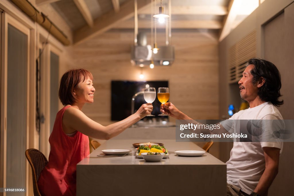 A couple enjoys staying in a villa on vacation.