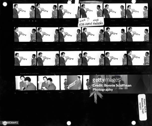 American trumpeter Herb Alpert and South African trumpeter Hugh Masekela play their trumpets in these twenty-three images on one proof sheet in Los...