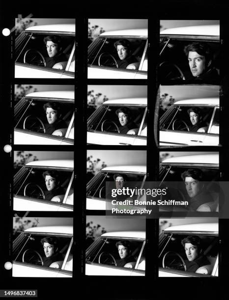 American filmmaker David Lynch poses for a portrait sitting in a Packard vehicle in these twelve images on one proof sheet in Los Angeles,...