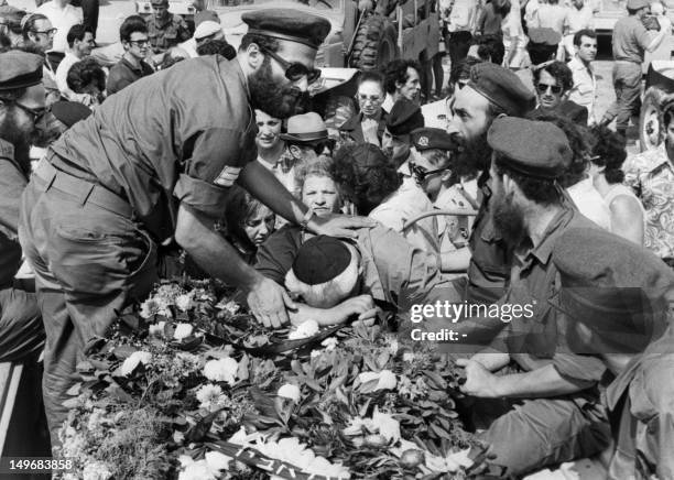 Members of family cry during the funerals of Israeli olympic team victims of the Palestinian hostage-taking, in September 1972 in Tel Aviv. During...