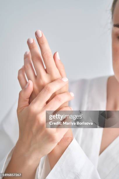 well-groomed female hands with manicure. - cream finger stock pictures, royalty-free photos & images