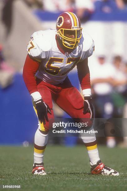 Ken Harvey of the Washington Redskins in position during a football game against the New England Patriots on October 13, 1996 at Sullivan Stadium in...