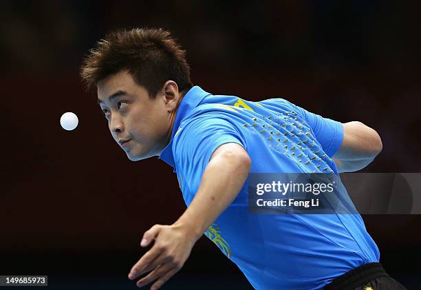 Wang Hao of China serves during Men's Singles Table Tennis Gold medal match against Zhang Jike of China on Day 6 of the London 2012 Olympic Games at...