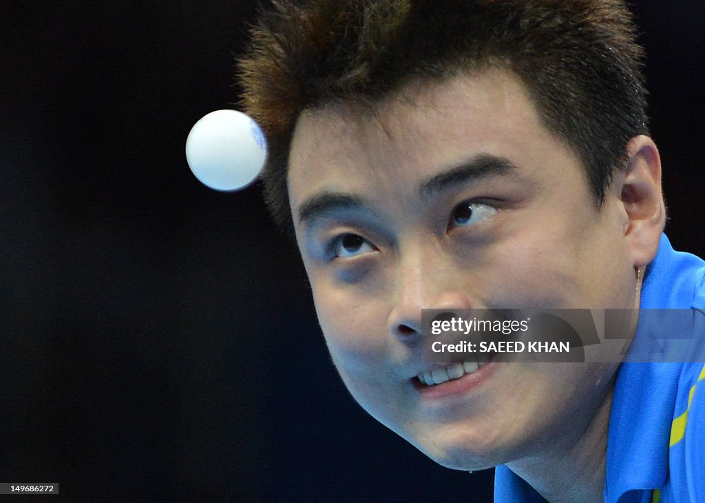 Wang Hao of China watches the ball as he