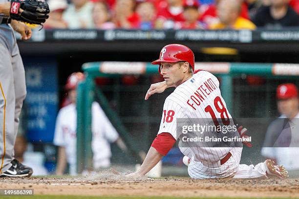 Mike Fontenot of the Philadelphia Phillies looks back after scoring a run during the game against the Pittsburgh Pirates at Citizens Bank Park on...