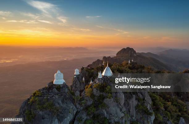 beautiful morning aerial view, white pagoda on top of a high mountain. - lampang province stock pictures, royalty-free photos & images