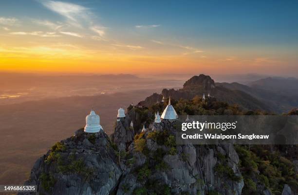 beautiful morning aerial view, white pagoda on top of a high mountain. - wat stock pictures, royalty-free photos & images